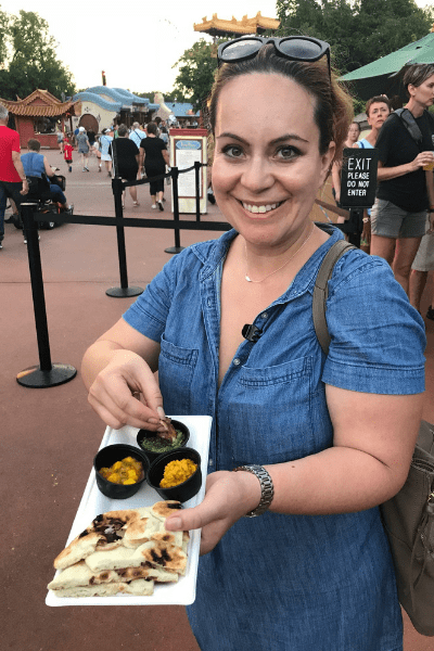 Best Places to Eat in Orlando Josh Elledge Epcot Food & Wine Festival Anna with Indian bread and dipping sauces