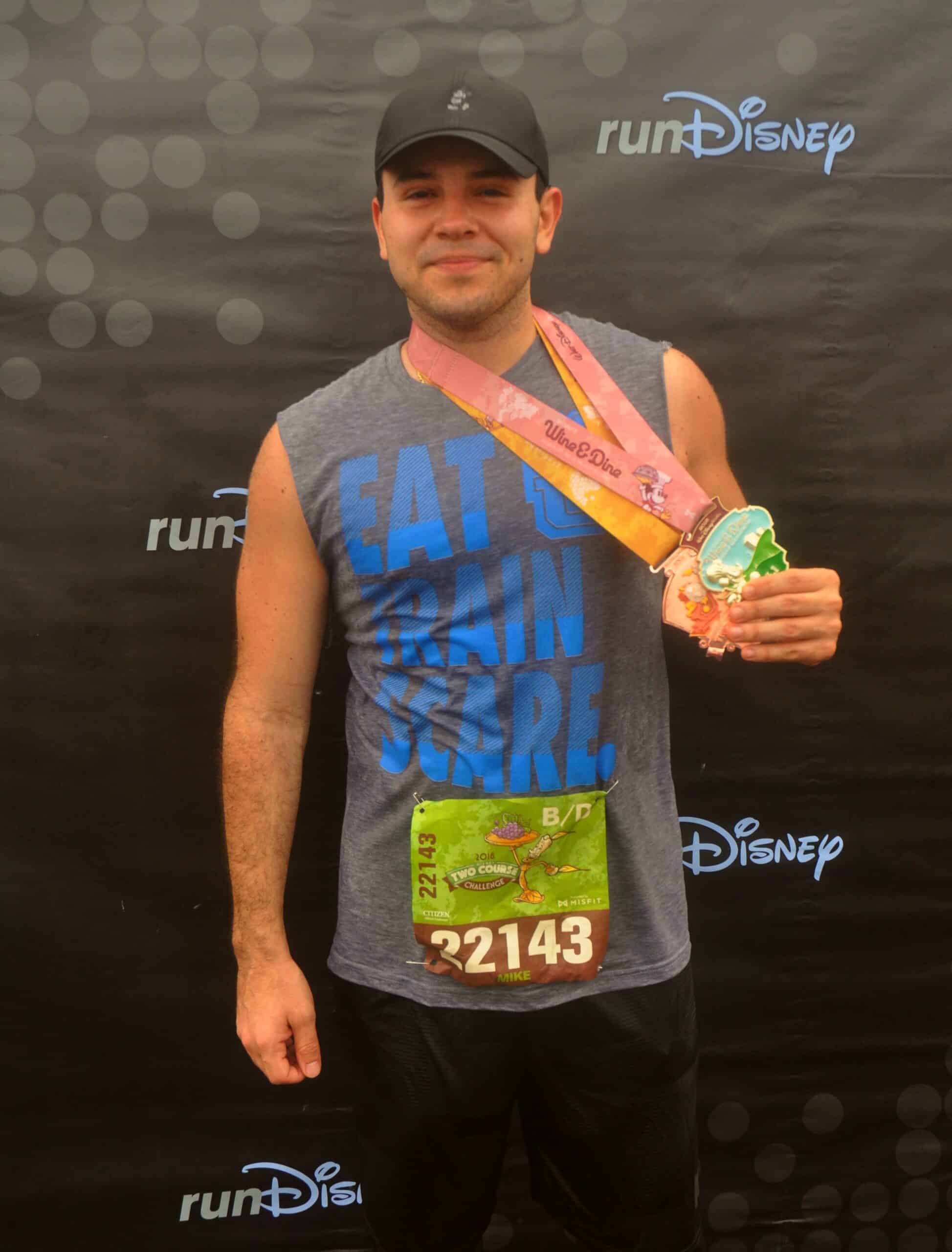How to save money at theme parks - Michael Belmont with Disney Marathon medals