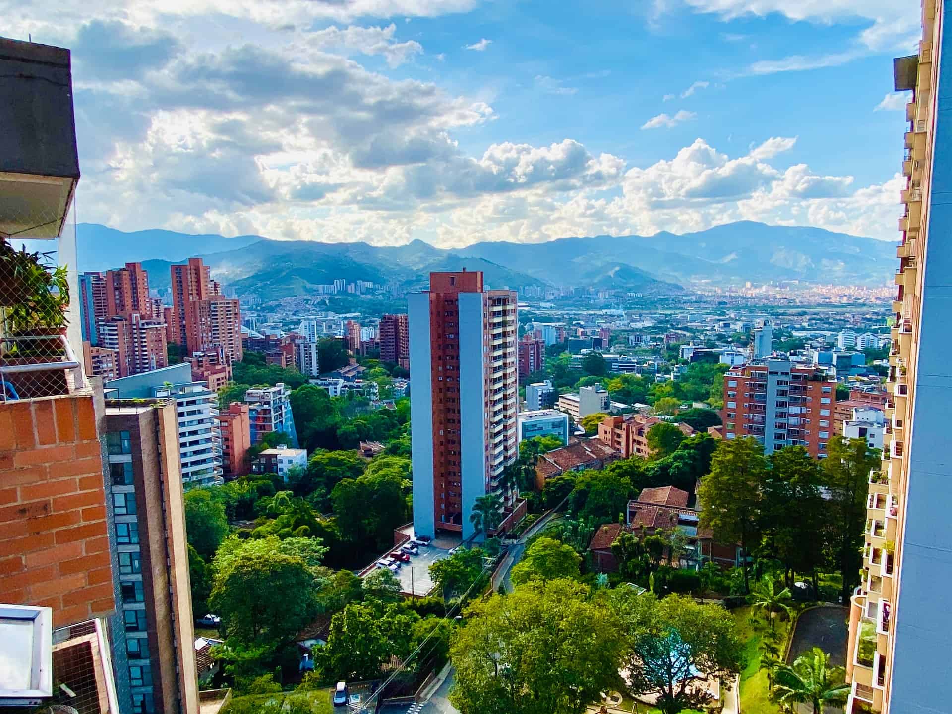 Best things to do in Medellin Colombia - Joseph Hogue - Mix of nature and man-made buildings by Mike Swigunski on Unsplash