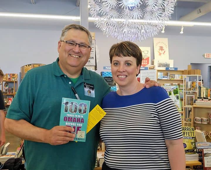 Best things to do in Omaha Nebraska - Tim and Lisa Trudell with book