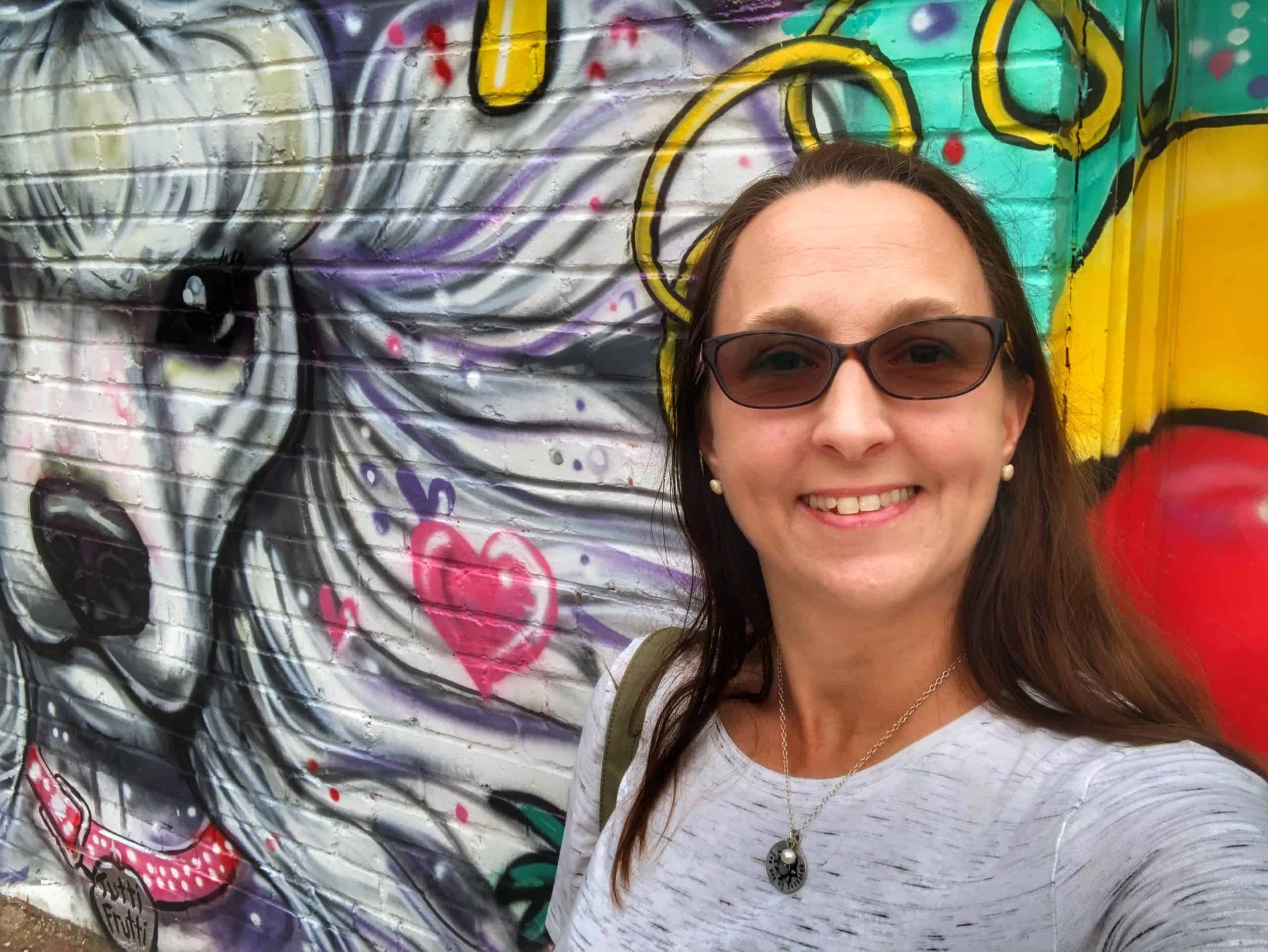 Best things to do in Oklahoma City OK - Nicky Omohundro - Plaza Walls mural selfie