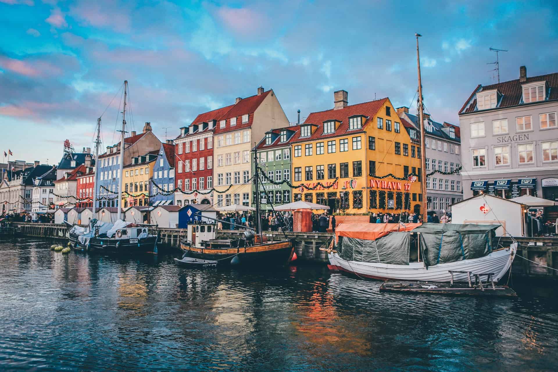 Best things to do in Copenhagen Denmark - Sally Bunnell - buildings on the water by Nick Karvounis on Unsplash