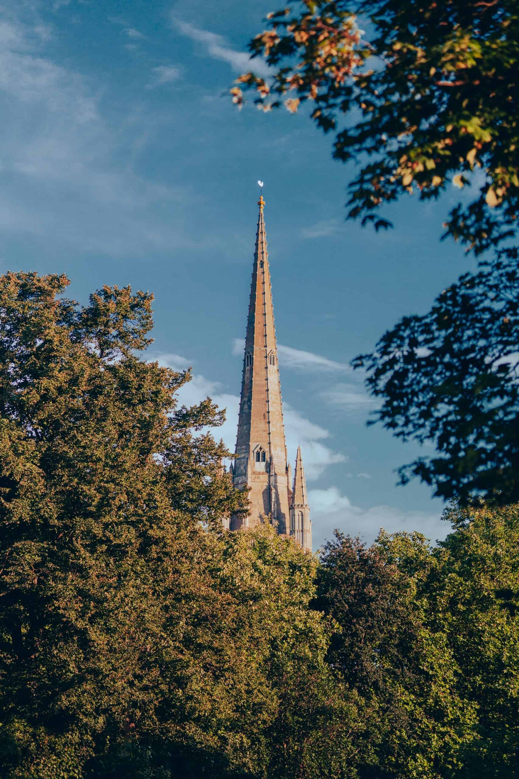 Best things to do in Norwich UK - James Hammond - Norwich Cathedral spire by Adam Rhodes on Unsplash