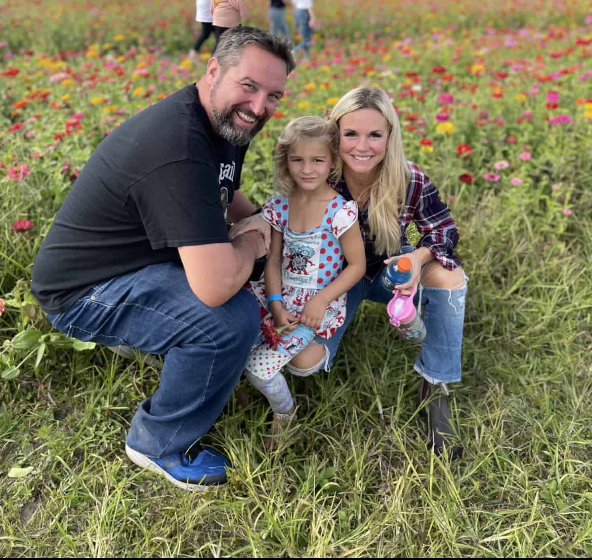 Best things to do in Wilmington NC - Pat Stoy his wife and daughter in wildflowers near the town center