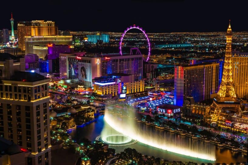 Best things to do in Las Vegas Nevada - David Gavri - Bellagio fountains and High Roller Ferris Wheel by Julian Paefgen on Unsplash