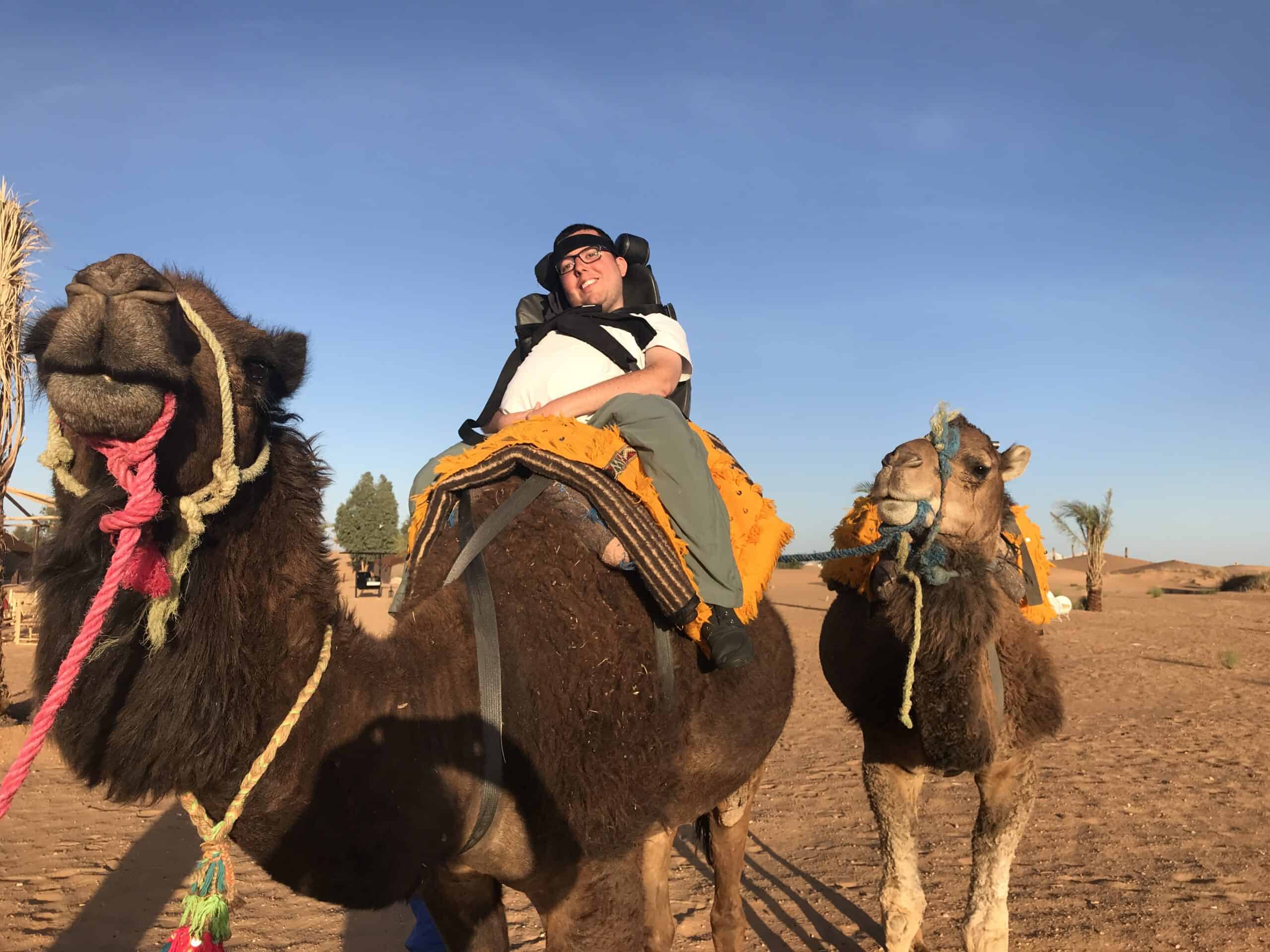 Accessible Travel with Cory Lee - On a camel in Morocco