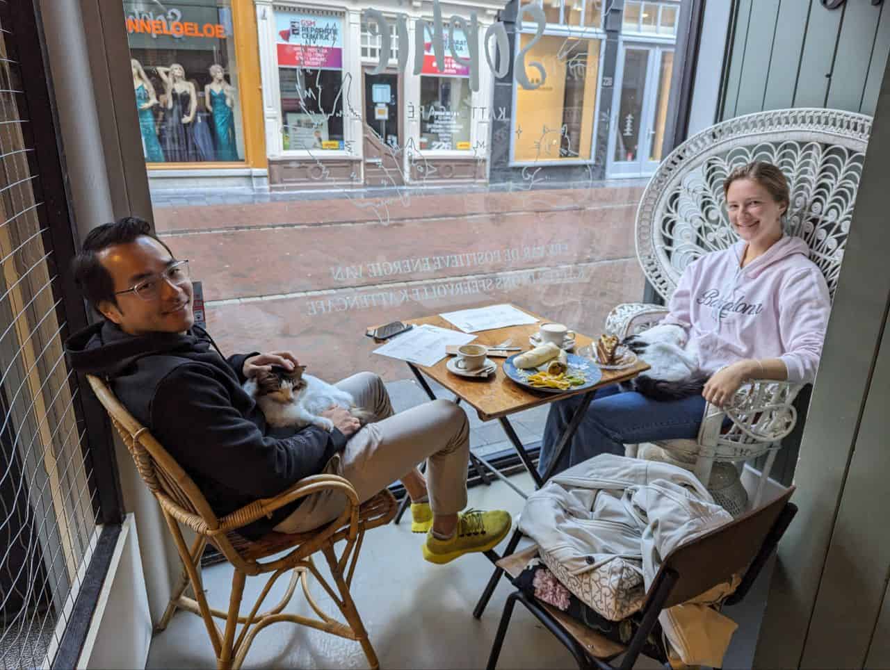 Best things to do in Leiden Netherlands - Marina Krivonossova - Marina and a friend from the US at Sophie KattenCafe